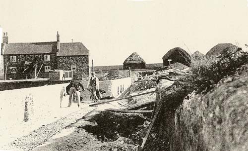 Point Cottages, haystacks and new brick wall  1900's
